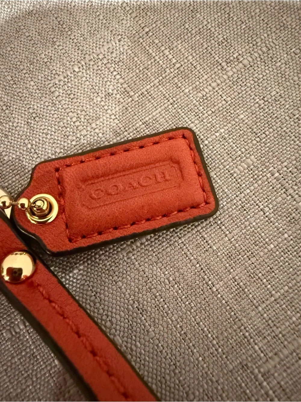 Coach Coral Leather Wristlet with Gold Plaque